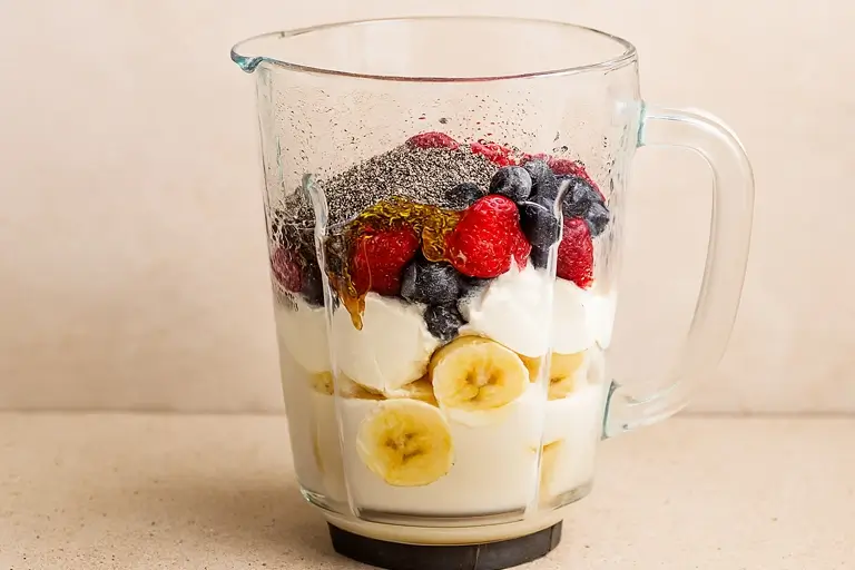 Blending Process: Chia seeds and fruits being blended together