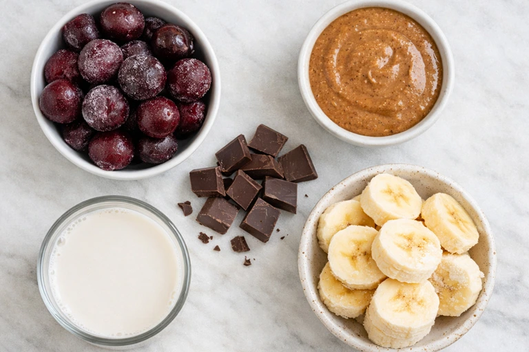 Frozen cherries, banana, almond butter, dark chocolate, almond milk